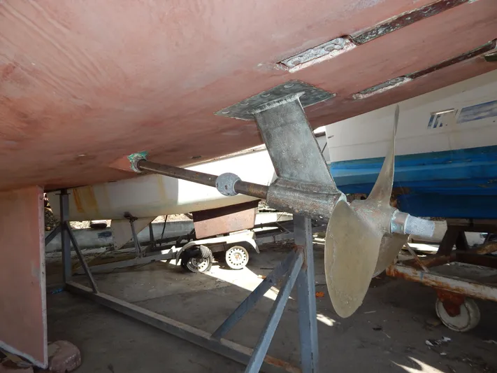  Yacht Photos Pics Underside view of 1992 Tayana 55 sailboat with visible propeller and rudder.