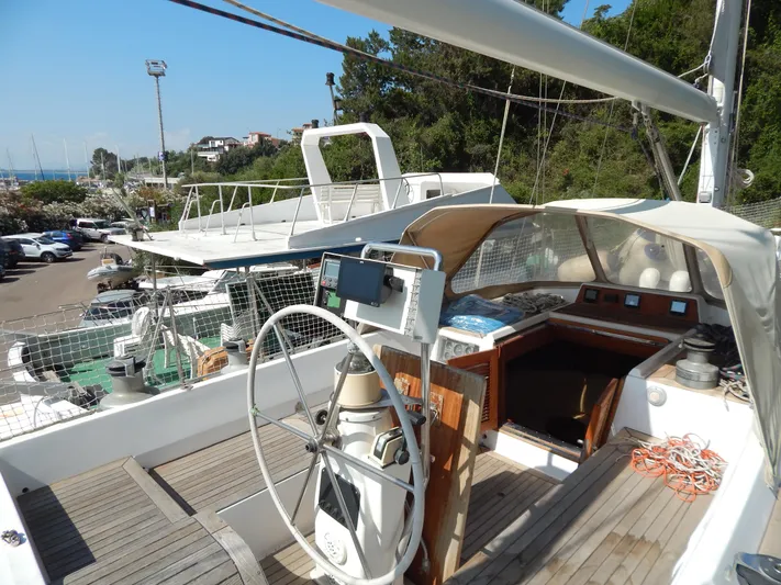  Yacht Photos Pics Sailboat cockpit of 1992 Tayana 55 with steering wheel and navigation equipment.