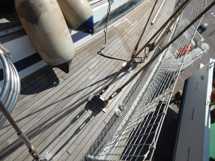  Yacht Photos Pics Deck of 1992 Tayana 55 sailboat with fenders and safety netting.