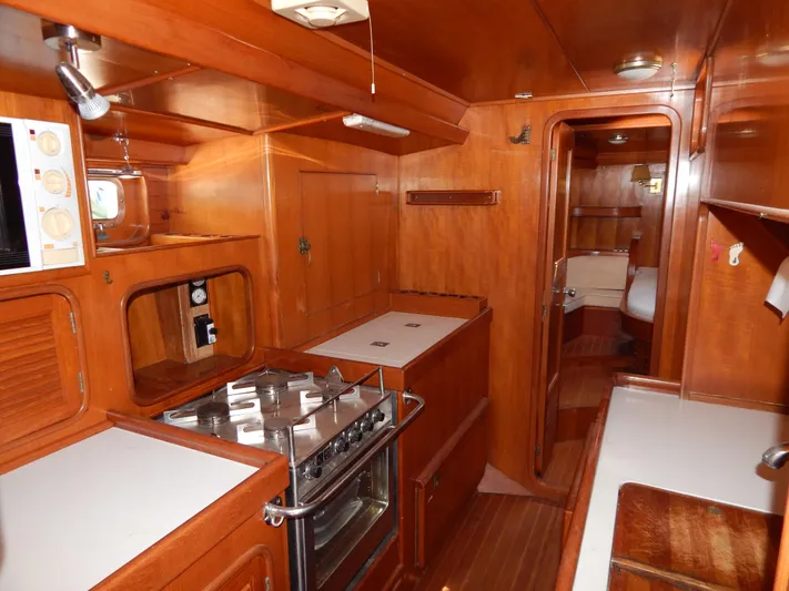  Yacht Photos Pics Interior of 1992 Tayana 55 yacht with wooden cabinetry and modern kitchen amenities.