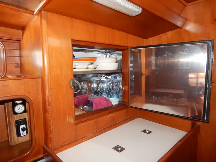  Yacht Photos Pics Interior of 1992 Tayana 55 yacht with wooden cabinetry and storage shelves.