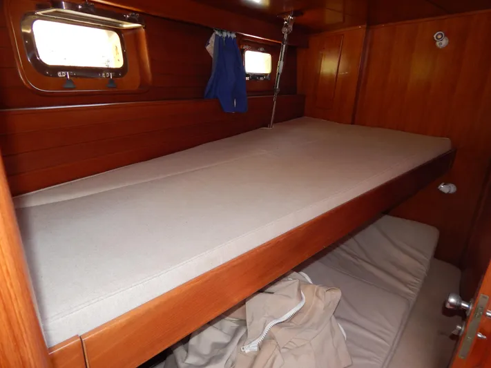  Yacht Photos Pics Interior cabin of 1992 Tayana 55 yacht with wooden bunk beds.