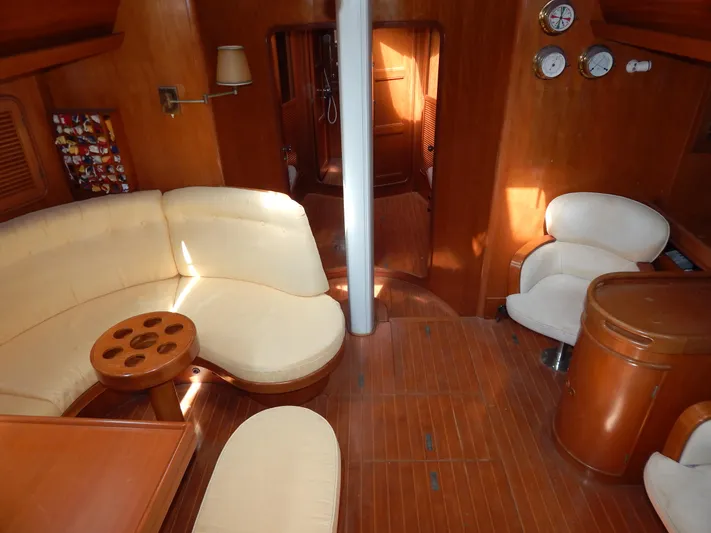  Yacht Photos Pics Luxurious 1992 Tayana 55 yacht interior with wooden flooring and plush seating.
