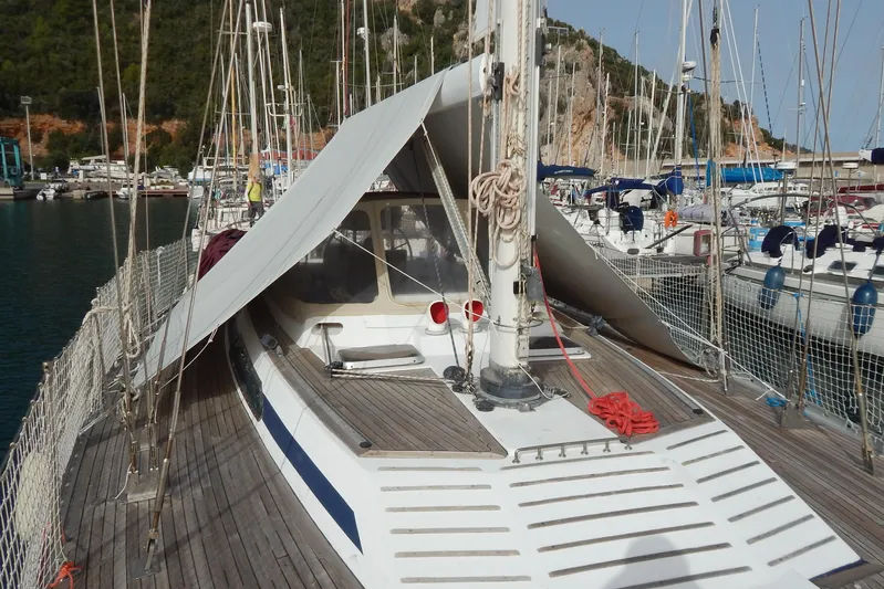  Yacht Photos Pics Sailboat Tayana 55, 1992 model, docked with sunshade, in a marina setting.