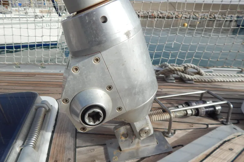  Yacht Photos Pics Deck fitting on 1992 Tayana 55 sailboat, featuring metal components and wooden deck.