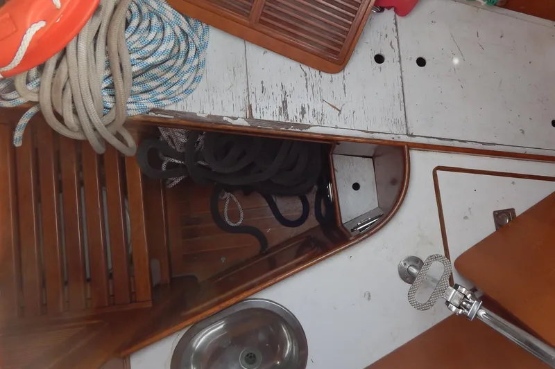  Yacht Photos Pics Interior of 1992 Tayana 55 sailboat with ropes and wooden flooring.
