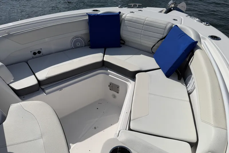  Yacht Photos Pics Luxurious seating area on 2024 Edgewater 262CC boat with blue cushions.