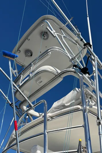 Reel Deal Yacht Photos Pics Carolina Classic 35 boat tower, 2001 model, against clear blue sky.