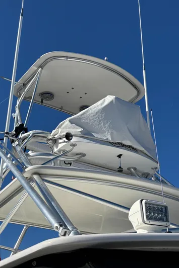 Reel Deal Yacht Photos Pics 2001 Carolina Classic 35 boat tower against clear blue sky.