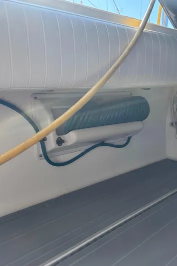 Reel Deal Yacht Photos Pics 2001 Carolina Classic 35 boat interior with cushioned seating and storage.