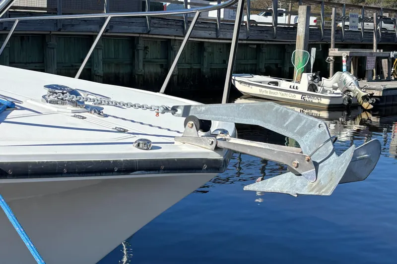 Reel Deal Yacht Photos Pics 2001 Carolina Classic 35 boat with anchor at dockside.