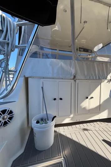 Reel Deal Yacht Photos Pics 2001 Carolina Classic 35 boat interior with storage cabinets and bucket.