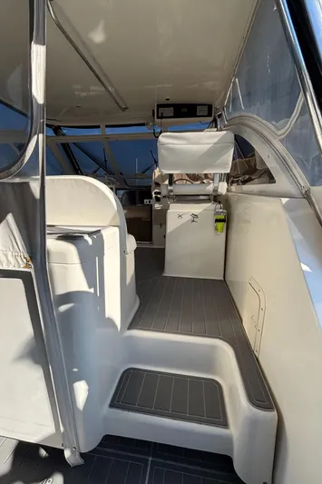 Reel Deal Yacht Photos Pics Interior view of 2001 Carolina Classic 35 boat, featuring seating and helm area.
