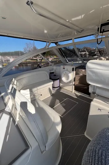 Reel Deal Yacht Photos Pics 2001 Carolina Classic 35 boat interior with white seating and modern design.