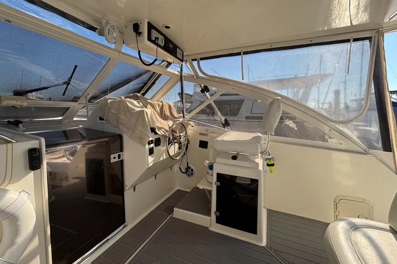 Reel Deal Yacht Photos Pics 2001 Carolina Classic 35 boat interior with helm and seating area.