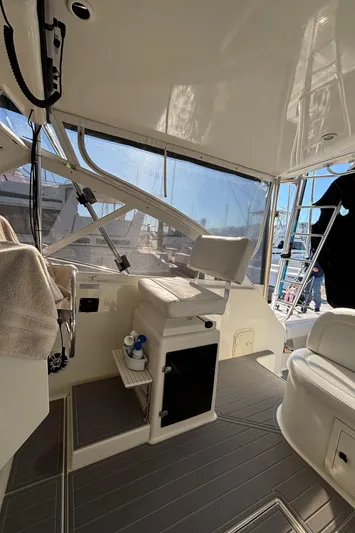 Reel Deal Yacht Photos Pics Interior of 2001 Carolina Classic 35 boat with seating and helm station.
