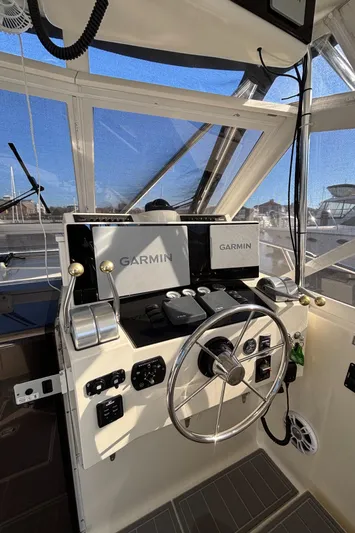 Reel Deal Yacht Photos Pics Helm of 2001 Carolina Classic 35 with Garmin navigation system.