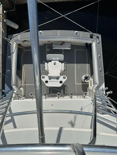 Reel Deal Yacht Photos Pics 2001 Carolina Classic 35 boat deck with fishing chair and equipment.