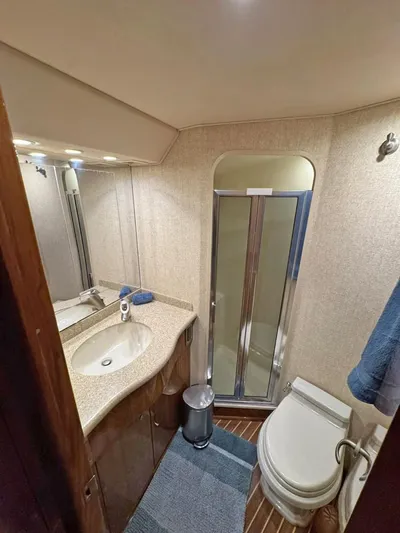  Yacht Photos Pics Bathroom interior of 2008 Viking 68 Convertible yacht with shower and sink.