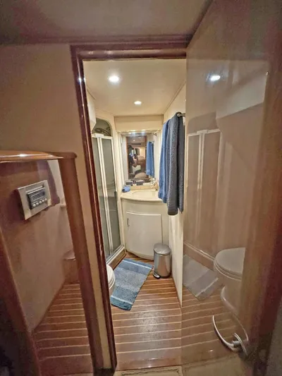  Yacht Photos Pics 2008 Viking 68 Convertible yacht bathroom with wood flooring and modern fixtures.