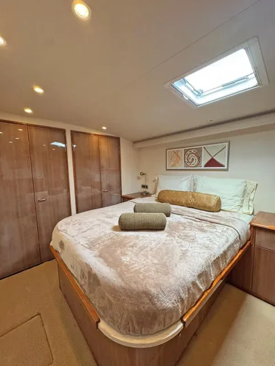  Yacht Photos Pics Luxurious bedroom in 2008 Viking 68 Convertible yacht with skylight and modern decor.