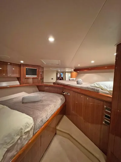  Yacht Photos Pics Luxurious cabin interior of 2008 Viking 68 Convertible yacht with cozy bedding.