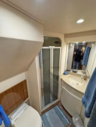  Yacht Photos Pics Bathroom interior of 2008 Viking 68 Convertible yacht with shower and sink.