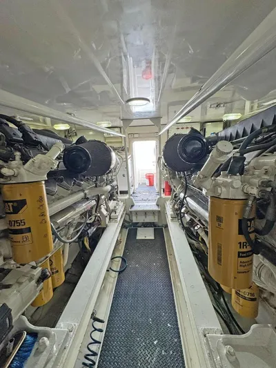  Yacht Photos Pics Engine room of a 2008 Viking 68 Convertible yacht, showcasing dual Caterpillar engines.