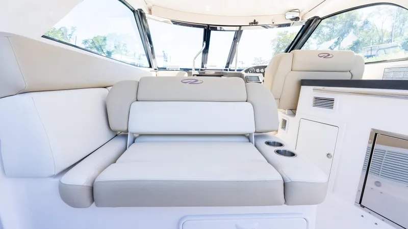  Yacht Photos Pics 2012 Regal 35 Sport Coupe interior with beige seating and modern design.