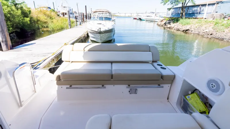  Yacht Photos Pics 2012 Regal 35 Sport Coupe docked, featuring spacious seating and serene waterfront view.