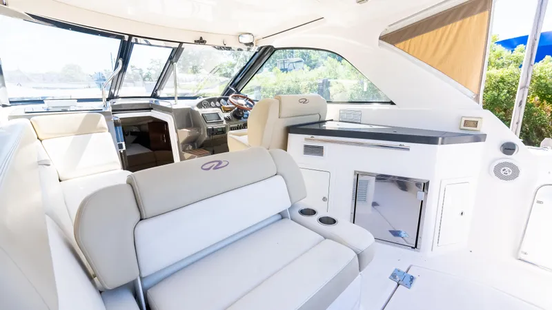  Yacht Photos Pics 2012 Regal 35 Sport Coupe interior with luxurious seating and modern helm.
