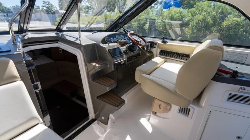  Yacht Photos Pics 2012 Regal 35 Sport Coupe interior with helm, steering wheel, and seating.