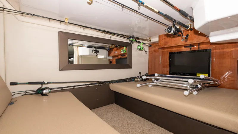  Yacht Photos Pics Interior of 2012 Regal 35 Sport Coupe with fishing rods and TV.