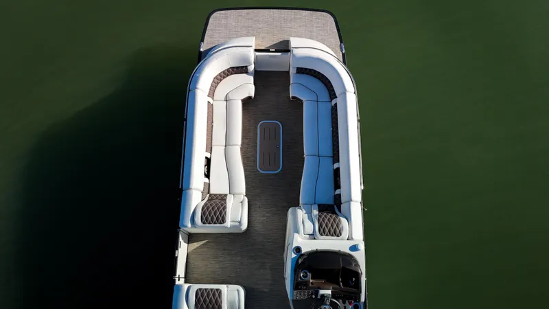  Yacht Photos Pics Aerial view of 2021 Bennington 27 QX pontoon boat on calm water.