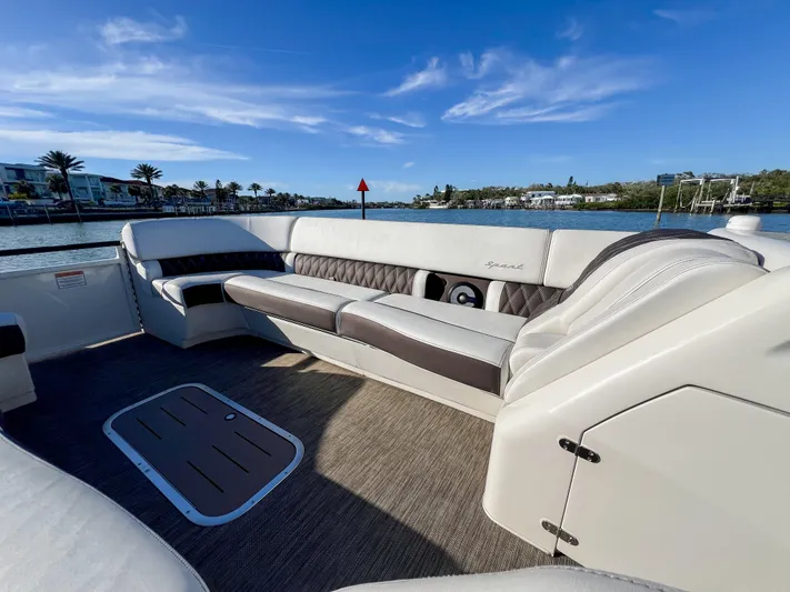  Yacht Photos Pics Luxurious seating on a 2021 Bennington 27 QX boat with scenic waterfront view.
