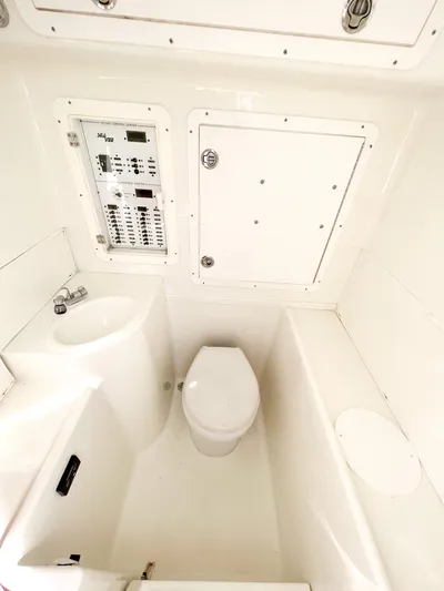  Yacht Photos Pics 2017 SeaVee 390z Center Console boat interior with toilet and control panel.