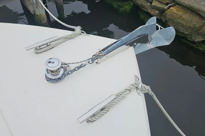 Tizzylizzy Yacht Photos Pics Bow of 1989 Post 43 Convertible boat with anchor and ropes.