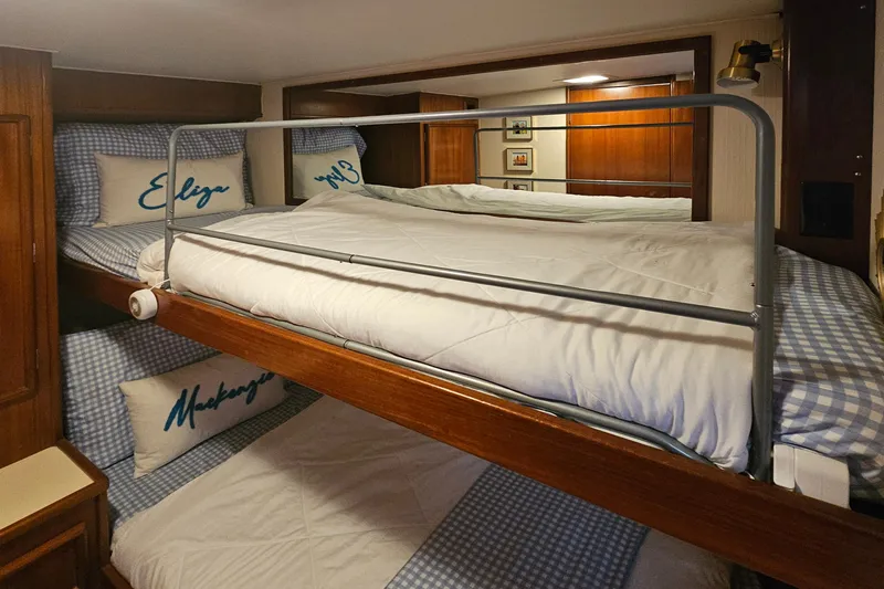 Tizzylizzy Yacht Photos Pics Bunk beds in 1989 Post 43 Convertible yacht cabin with checkered bedding and personalized pillows.