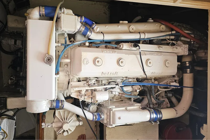 Tizzylizzy Yacht Photos Pics Engine of a 1989 Post 43 Convertible boat, featuring intricate piping and components.