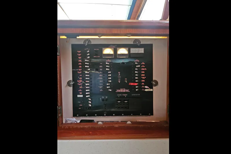 Tizzylizzy Yacht Photos Pics Electrical panel on a 1989 Post 43 Convertible boat, featuring gauges and switches.