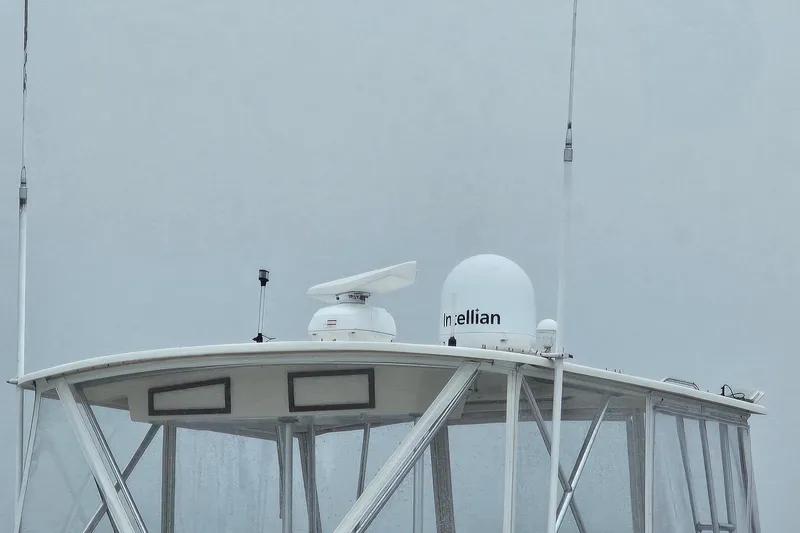 Tizzylizzy Yacht Photos Pics 1989 Post 43 Convertible boat with radar and communication equipment on the roof.