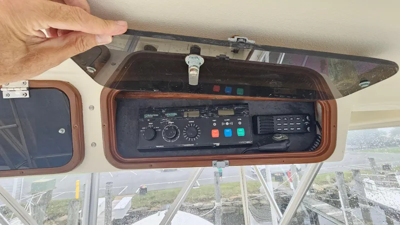Tizzylizzy Yacht Photos Pics Control panel of a 1989 Post 43 Convertible boat with radio and switches.