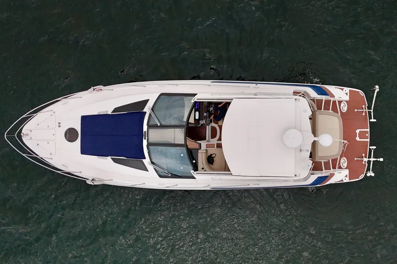 Knot Seine Yacht Photos Pics Aerial view of 2013 Regal 42 Sport Coupe yacht on water.