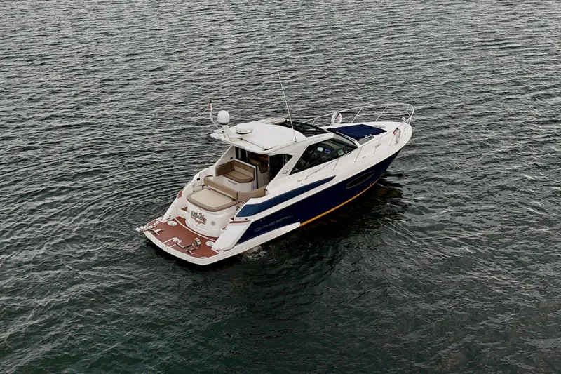 Knot Seine Yacht Photos Pics 2013 Regal 42 Sport Coupe yacht cruising on open water.