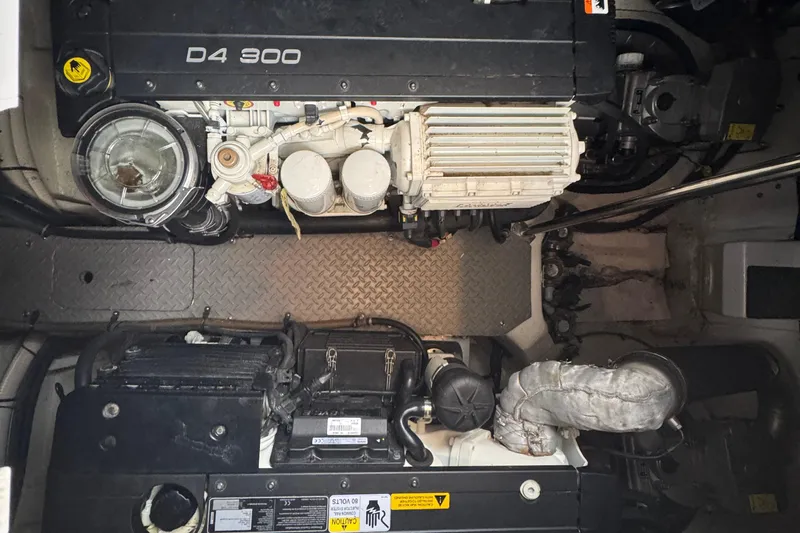 Knot Seine Yacht Photos Pics Engine compartment of a 2013 Regal 42 Sport Coupe with D4 300 engines.