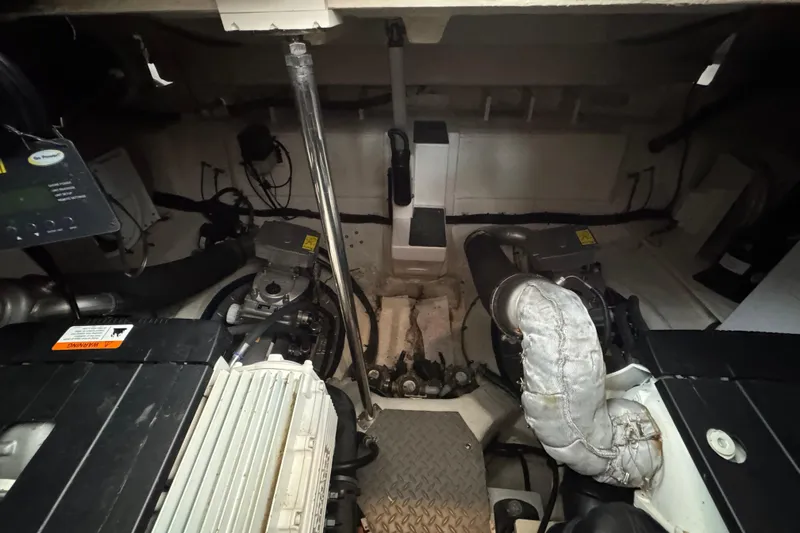 Knot Seine Yacht Photos Pics Engine room of 2013 Regal 42 Sport Coupe, showcasing mechanical components and systems.