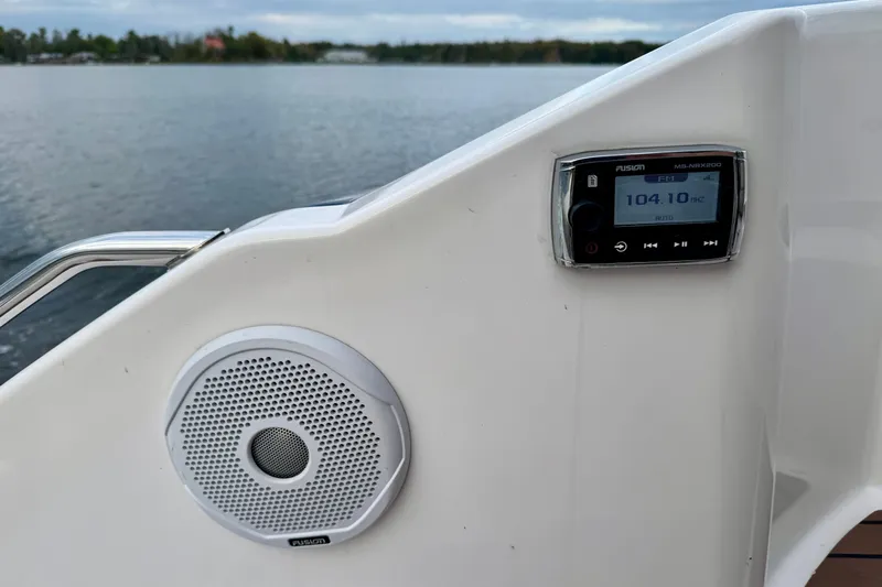 Knot Seine Yacht Photos Pics 2013 Regal 42 Sport Coupe boat with Fusion stereo system and speaker by the water.