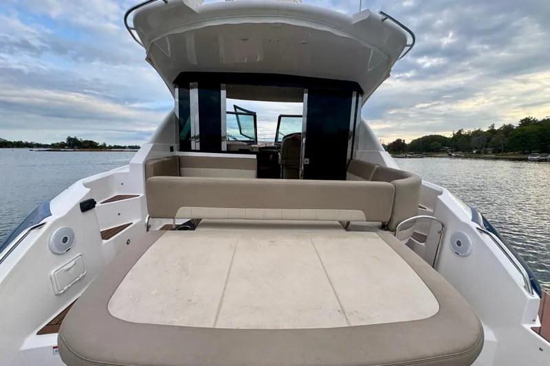 Knot Seine Yacht Photos Pics 2013 Regal 42 Sport Coupe yacht with spacious deck and scenic water view.