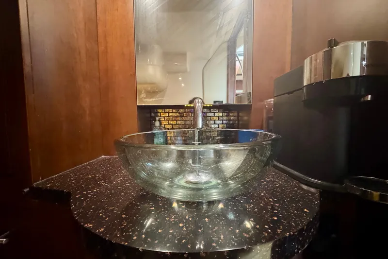 Knot Seine Yacht Photos Pics Glass sink and countertop in 2013 Regal 42 Sport Coupe bathroom.