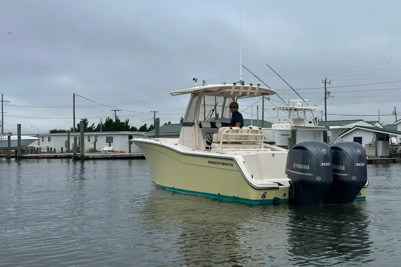  Yacht Photos Pics 2020 Grady-White Canyon 271 boat with dual Yamaha engines on calm water.